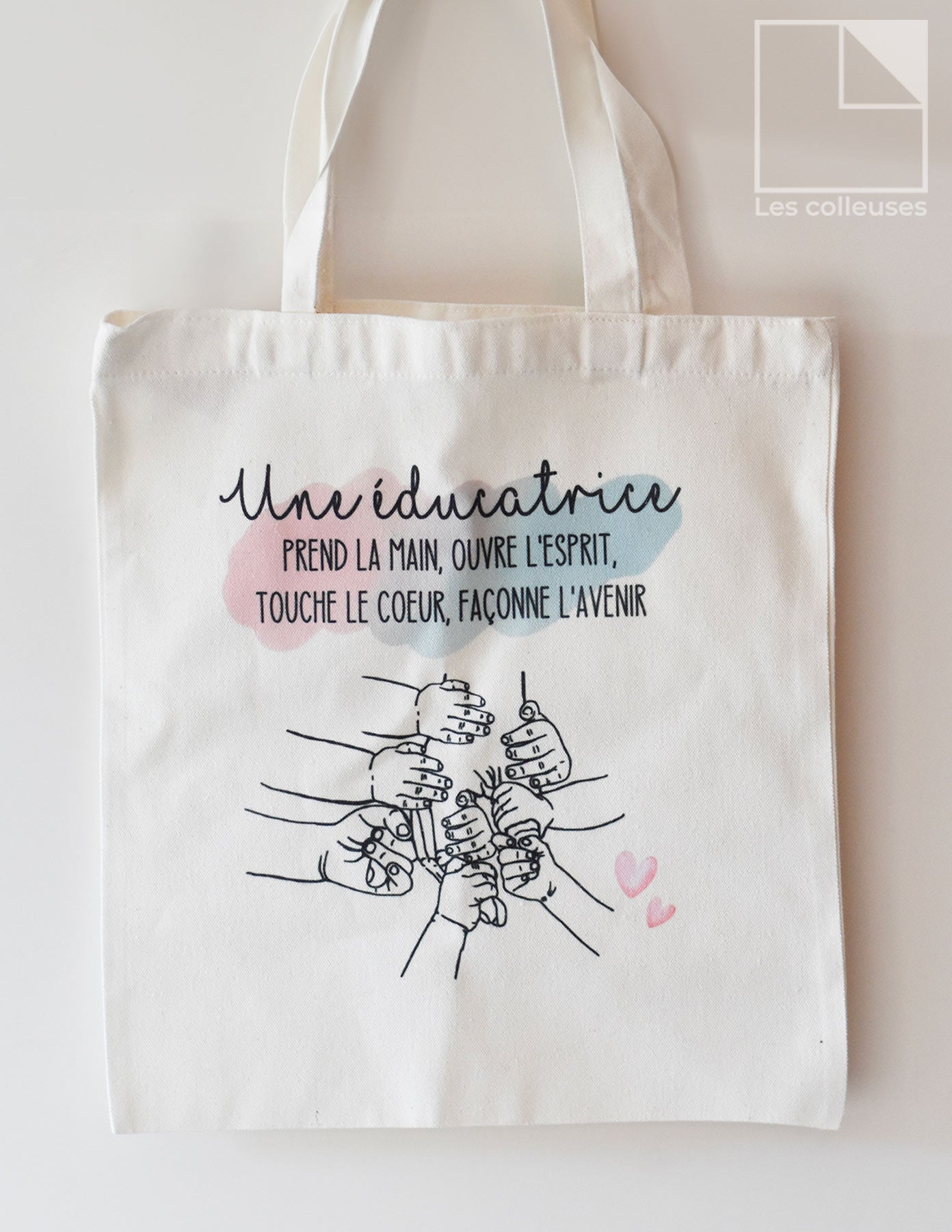 Sac fourre-tout « Une éducatrice prend la main »