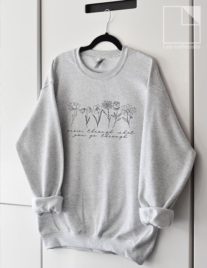 Chandail crewneck « Grow through what you go through »